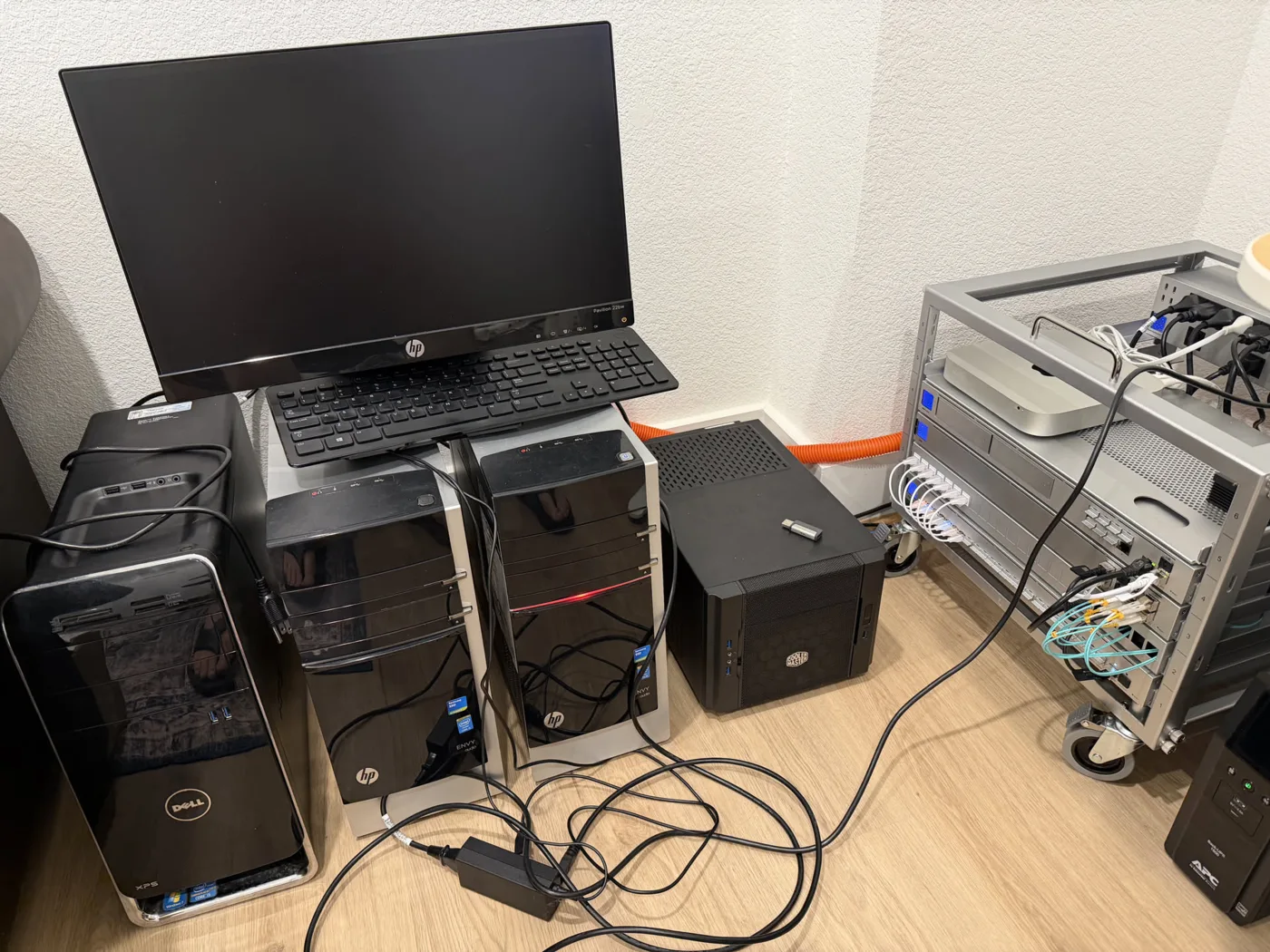 Homelab v2 with servers, monitor, and rack equipment